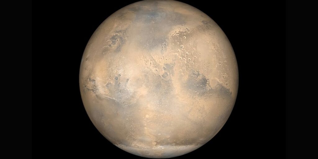 Simulerad vy av Mars sedd från rymdsonden Mars Global Surveyor. (Bild: NASA/Unsplash)